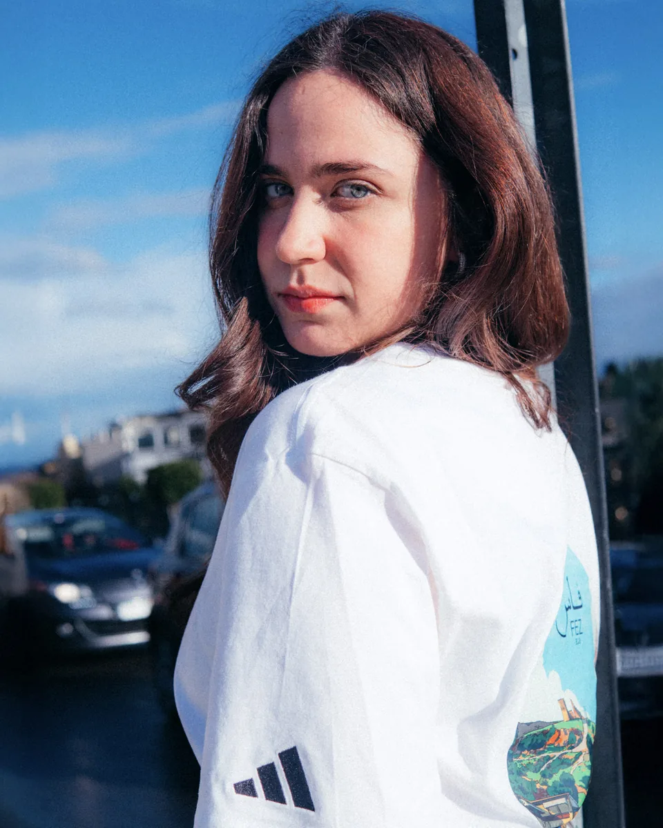 Adidas portrait against a city skyline