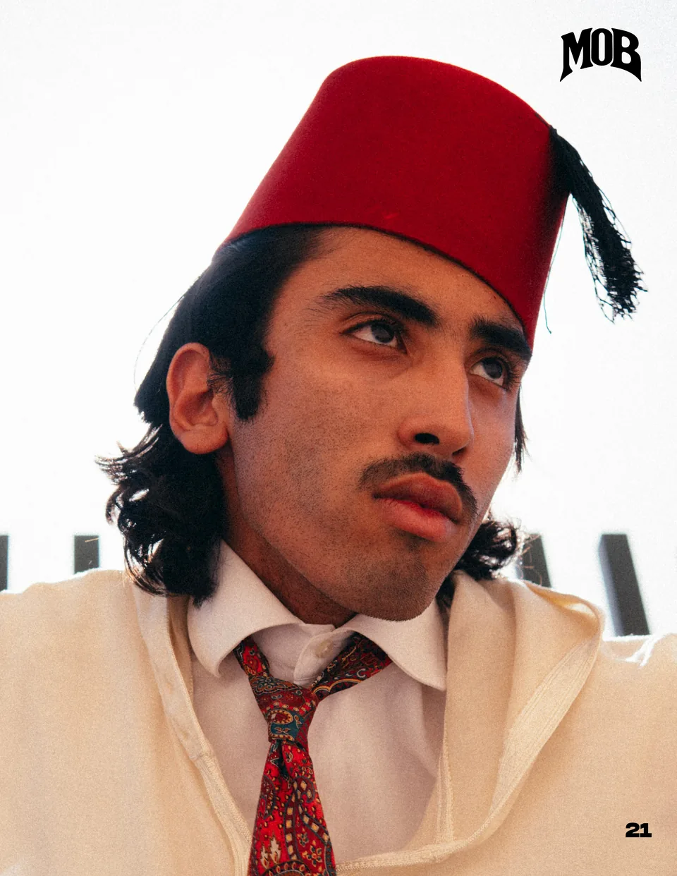 Studio portrait in a red tarboosh